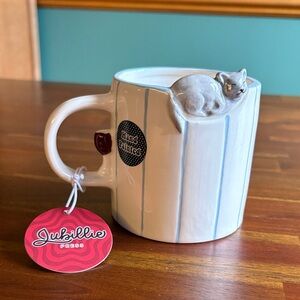 Unique Ceramic Mug with Cat figurine perched on top of the rim.
Brand new.